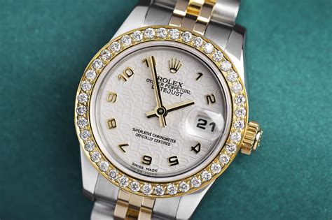 yg ladies rolex w diamond bezel